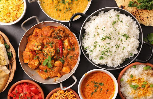 Clay Pit signature dishes Chicken Tikka MasalaLamb VindalooCurried Mussels